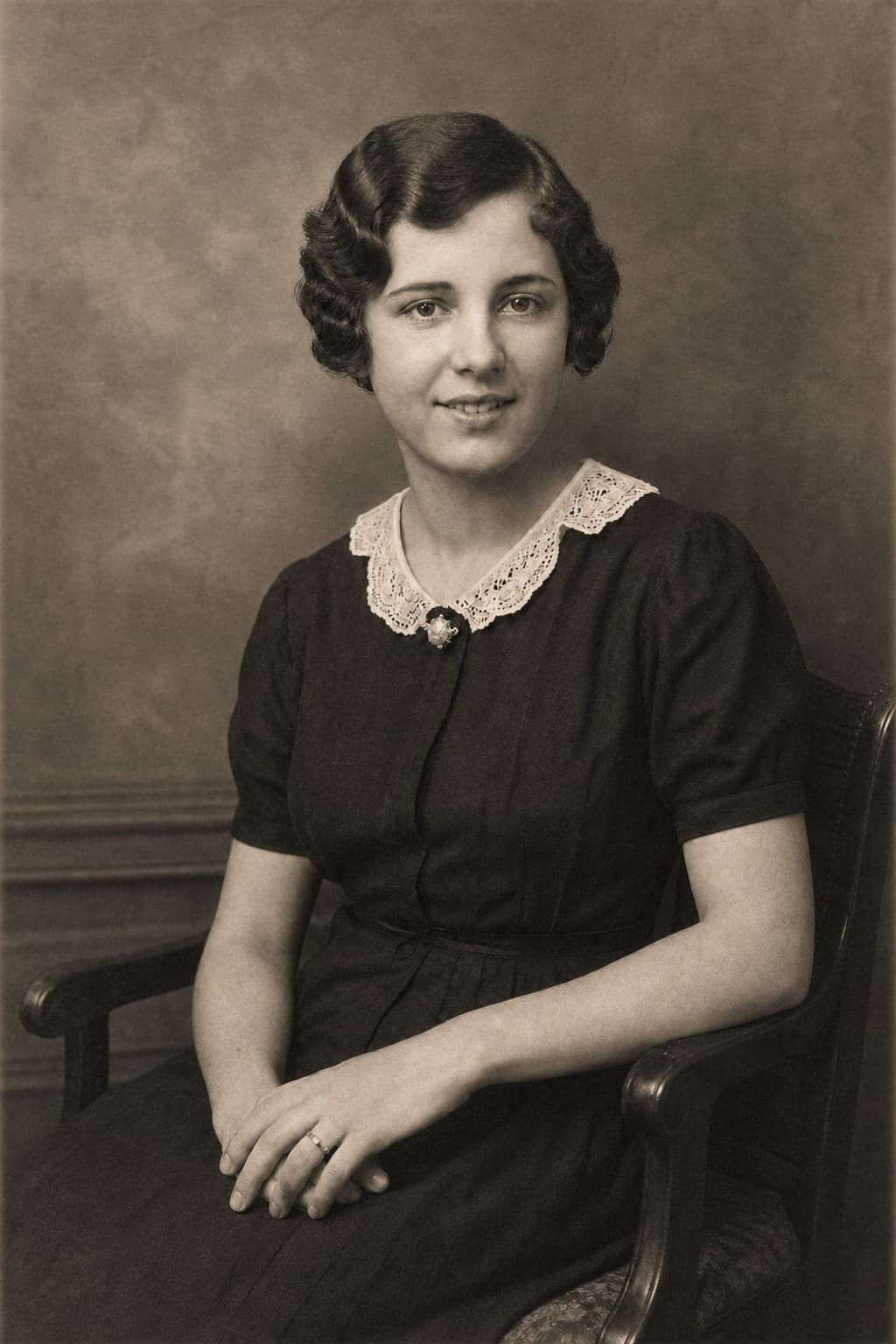 The same portrait restored, with the creases, stains and torn corner repaired